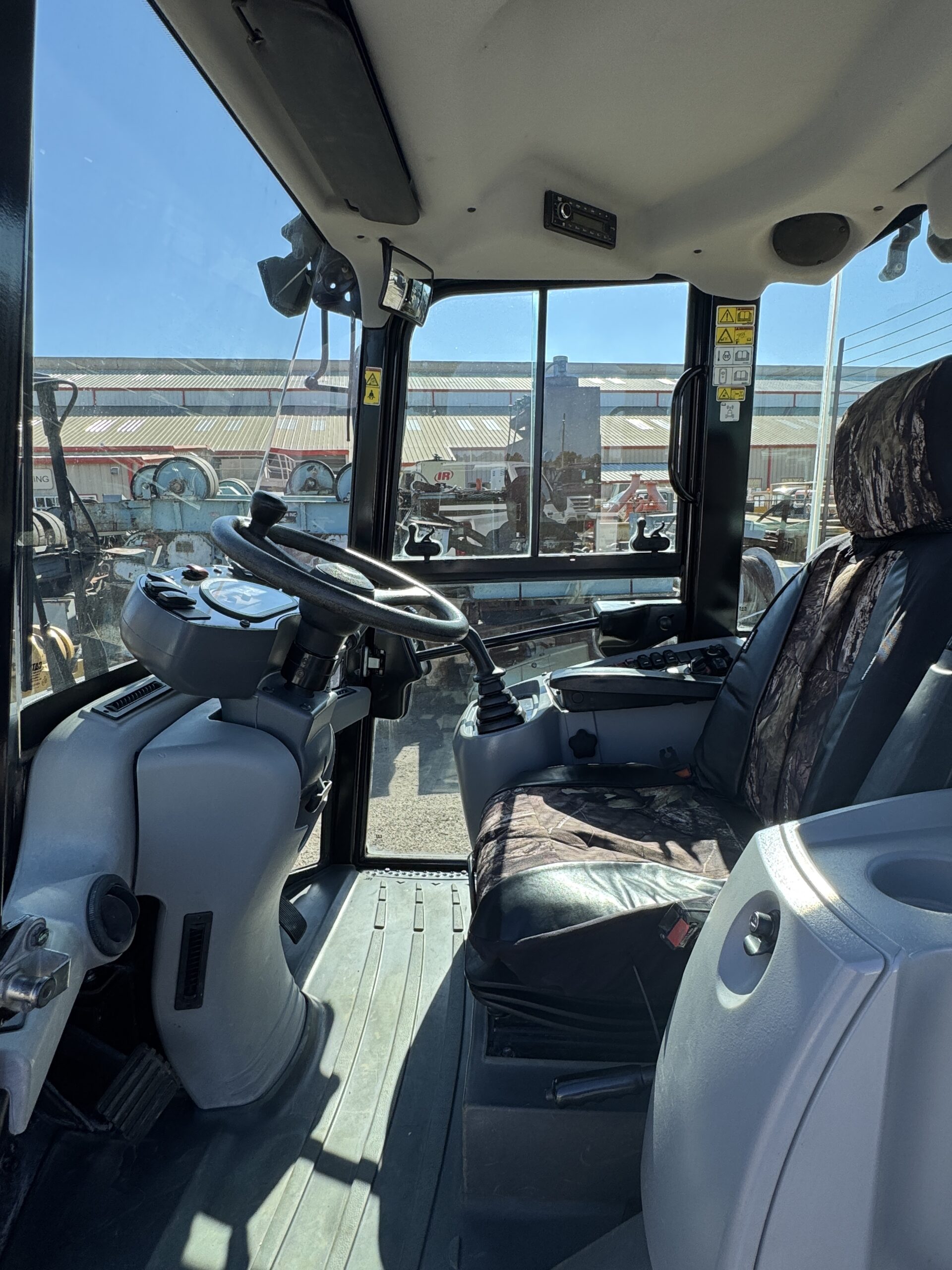 Cab interior view 1 showing interior on used Cat 906M Wheel loader