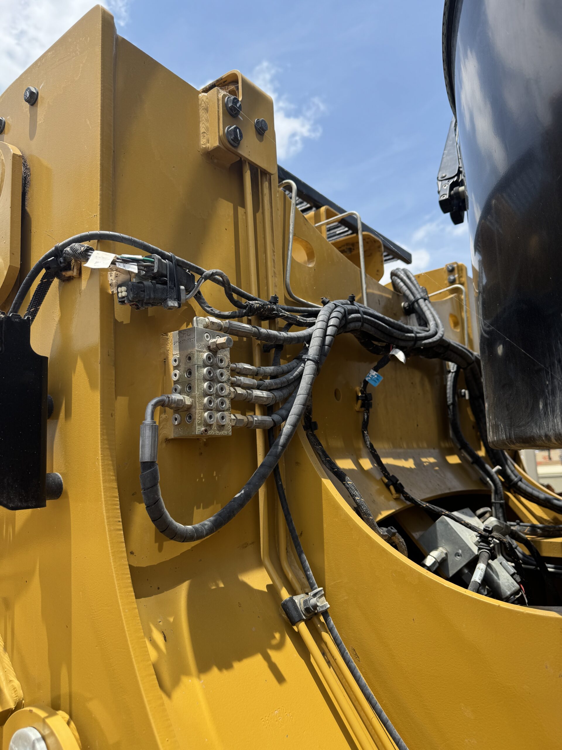 Up close mechanical view of late model Cat 966KM with only 790 hours for sale.