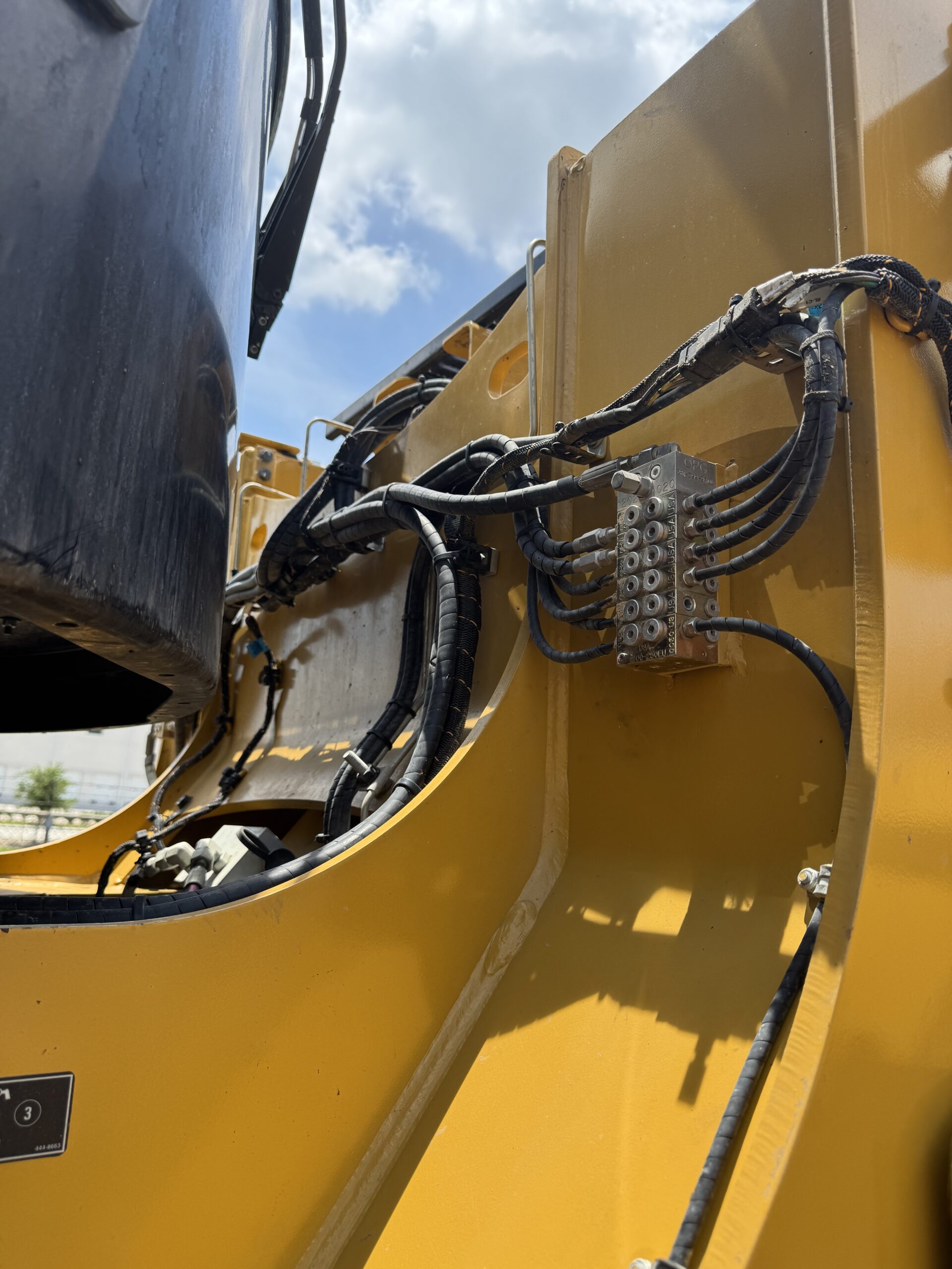 Up close cab view of late model Cat 966KM with only 790 hours for sale.
