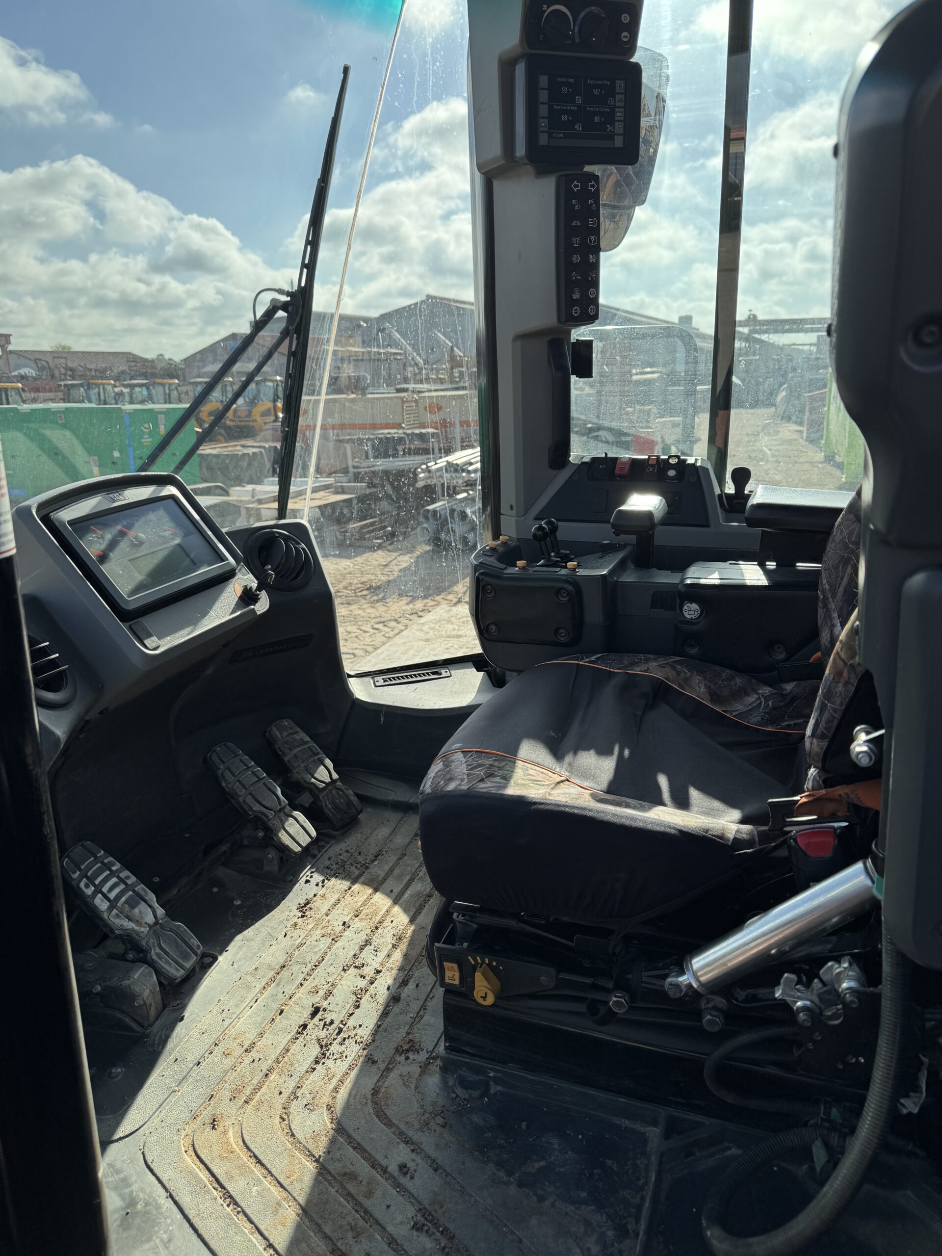 Operator cab interior of Cat 982M with modern controls and HVAC