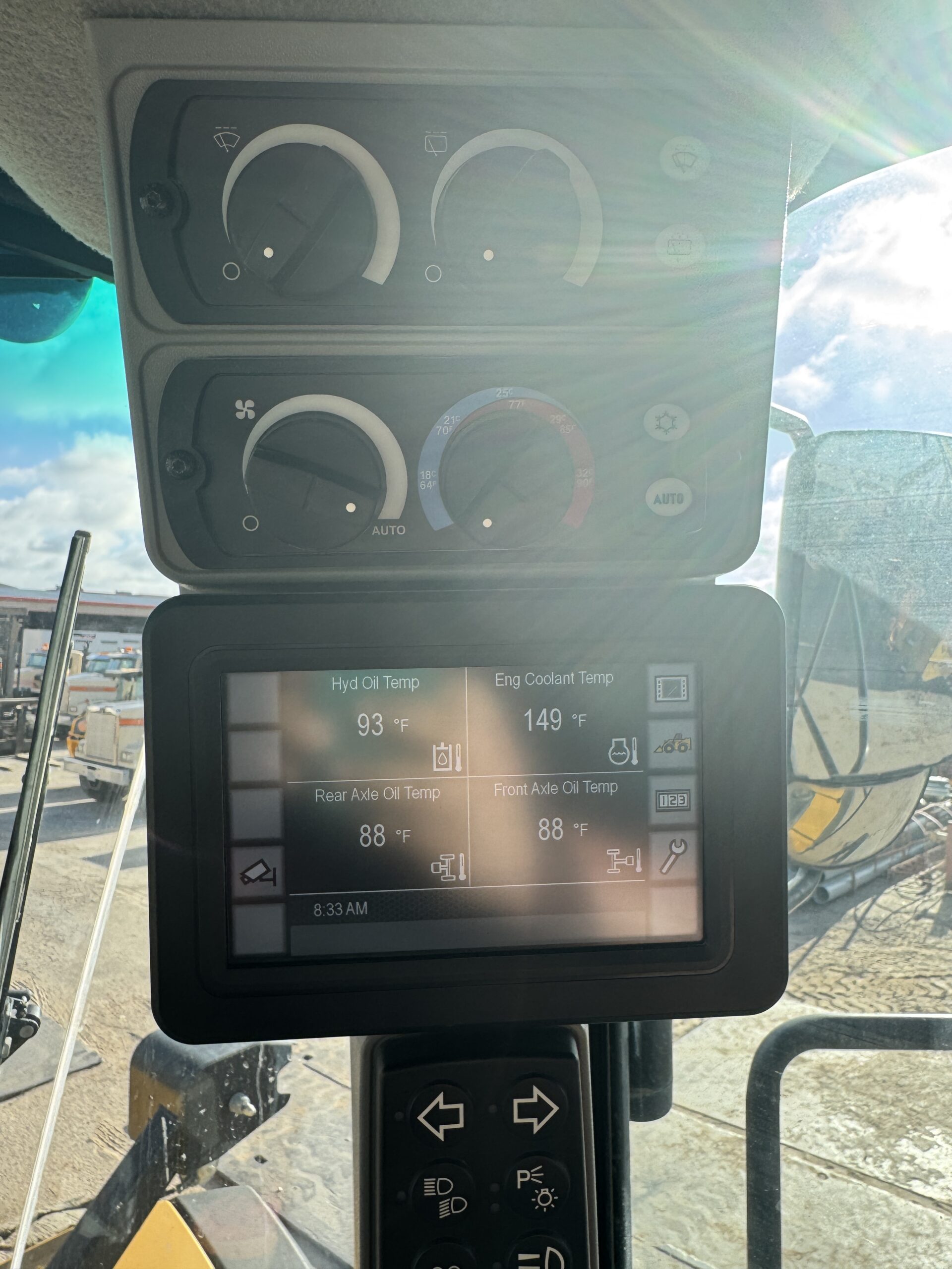 Operator cab interior view 2 of Cat 982M with modern controls and HVAC