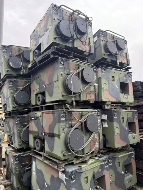 Palletized stack of used military surplus portable duct type heaters in camouflage finish, Model H140, available at Boyer Equipment in Houston, TX.